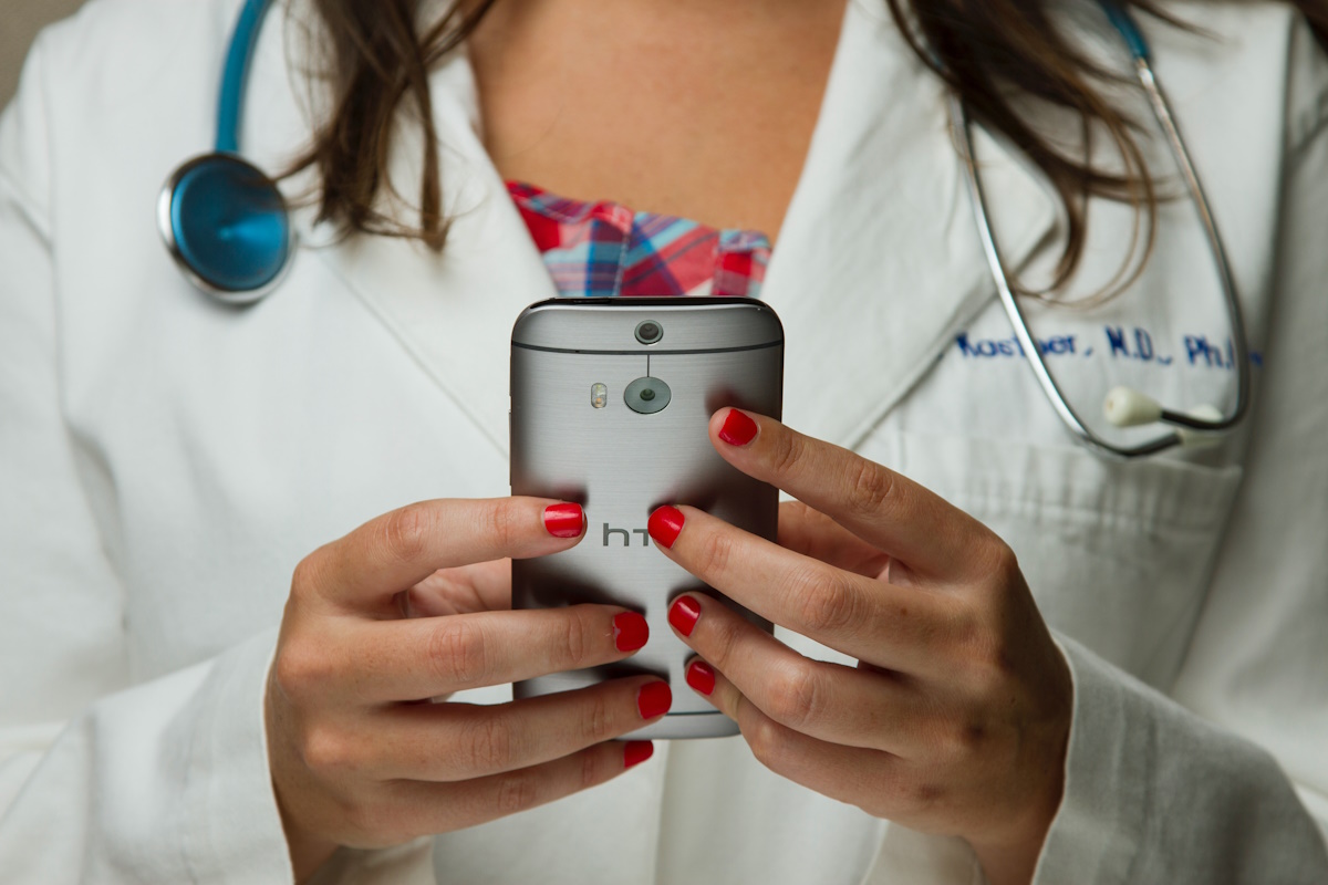 Photo of healthcare professional using mobile phone